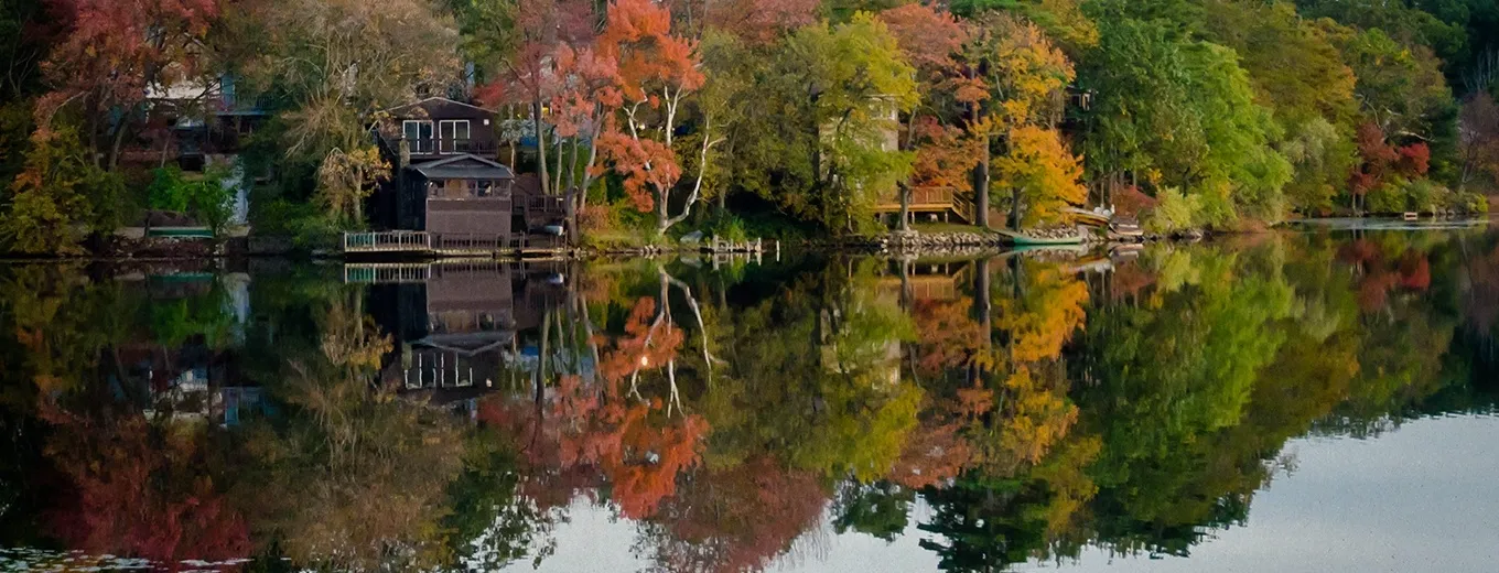 colorful autumn trees by a lake